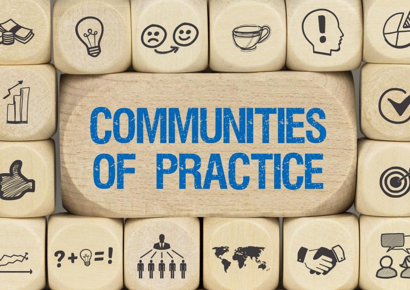 An illustration of dice stacked around the words, ‘Communities of Practice’.