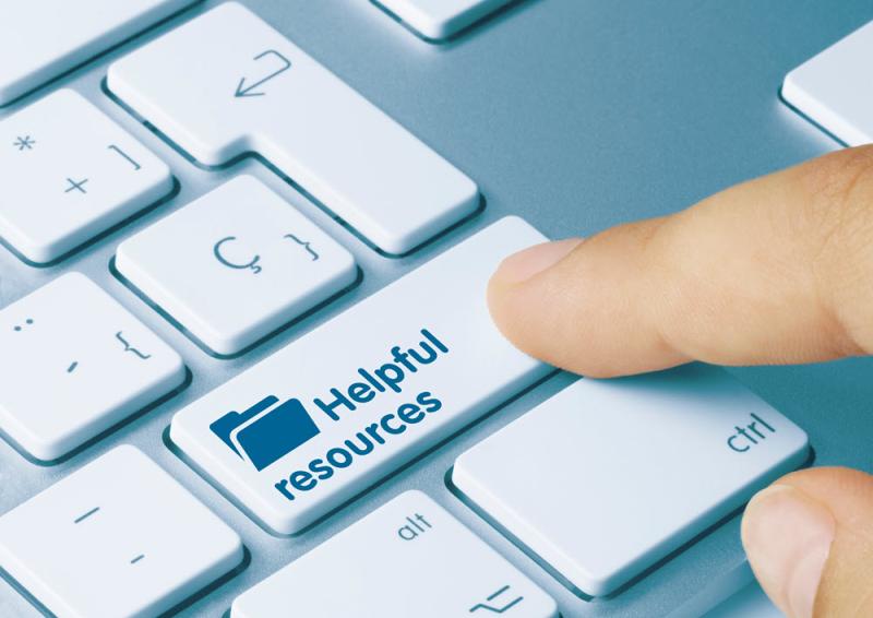 A close up image of a section of a laptop keyboard keys with the ‘enter’ key showing the wording, ‘helpful resources’ with a picture of a folder on the key.