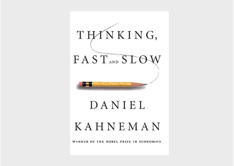 Book cover of Daniel Kahneman’s book, ‘Thinking fast and slow.” Includes an illustrative pencil underneath the book title. 