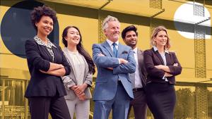 Five people standing.  Three have their arms crossed.