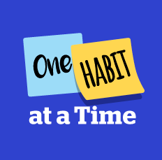 A blue background with two Post it Notes, one note says "One" the second note says "Habit" and wording underneath says "at a Time" 